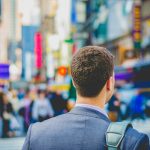 shallow focus photography of man in suit jacket's back